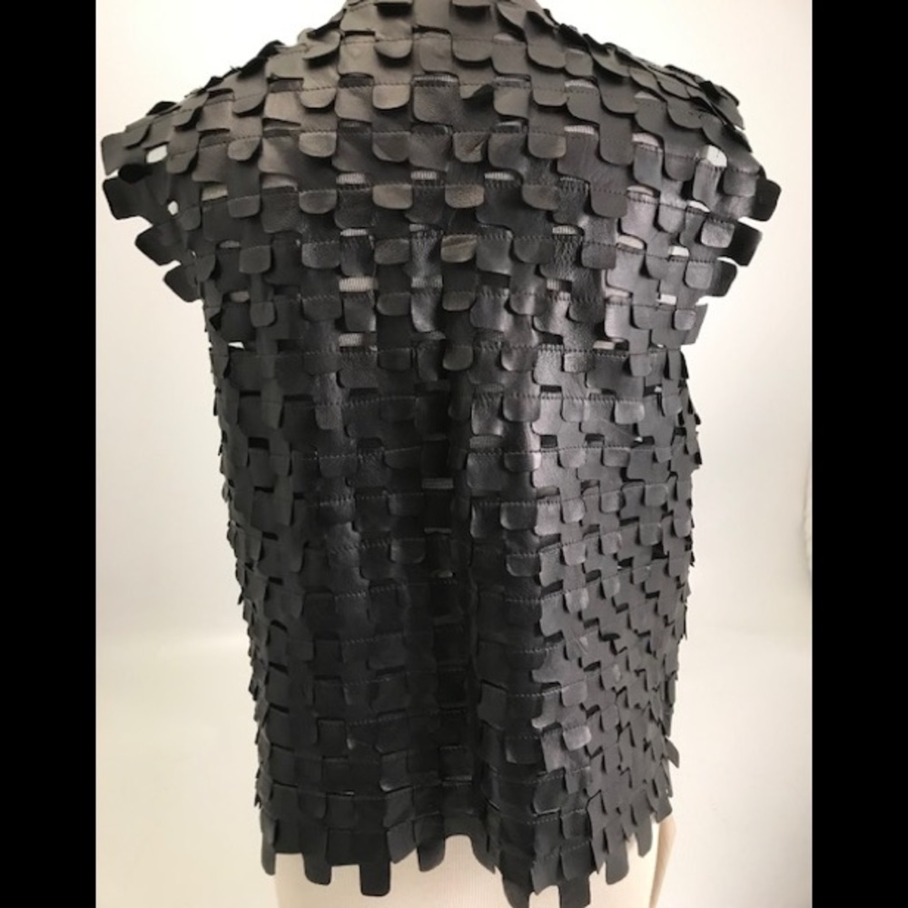 Leather vest made of recycled vegetable tanned Napa leather. All black/new tag.